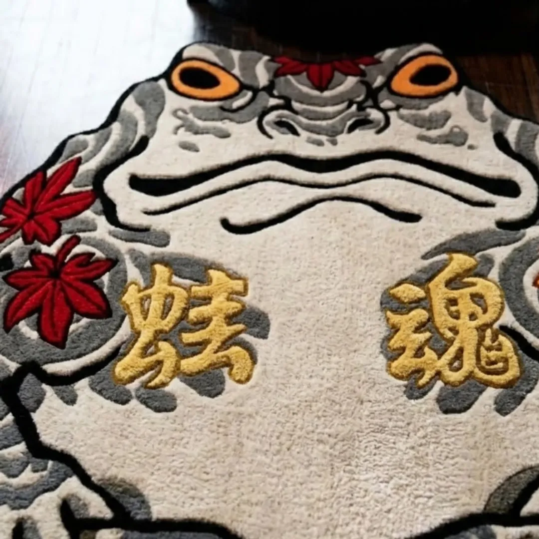 Close-up of the detailed tufted pile texture, Japanese kanji characters, red maple leaves, and intricate linework on the Kaeru Ronin rug.