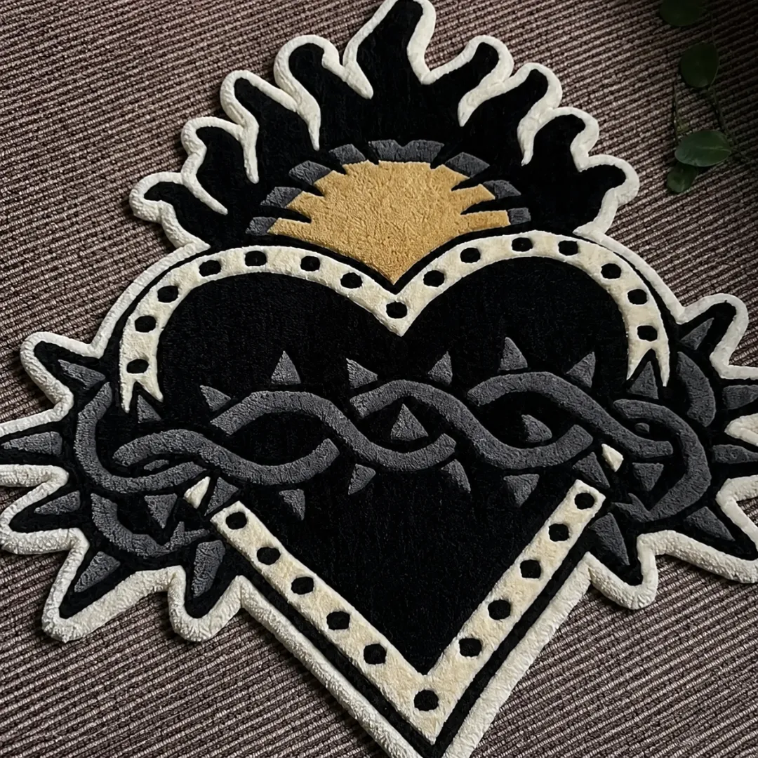 Close-up of the detailed tufted pile texture, intricate crown of thorns motif, and bold black and white linework on the Sacred Heart rug.