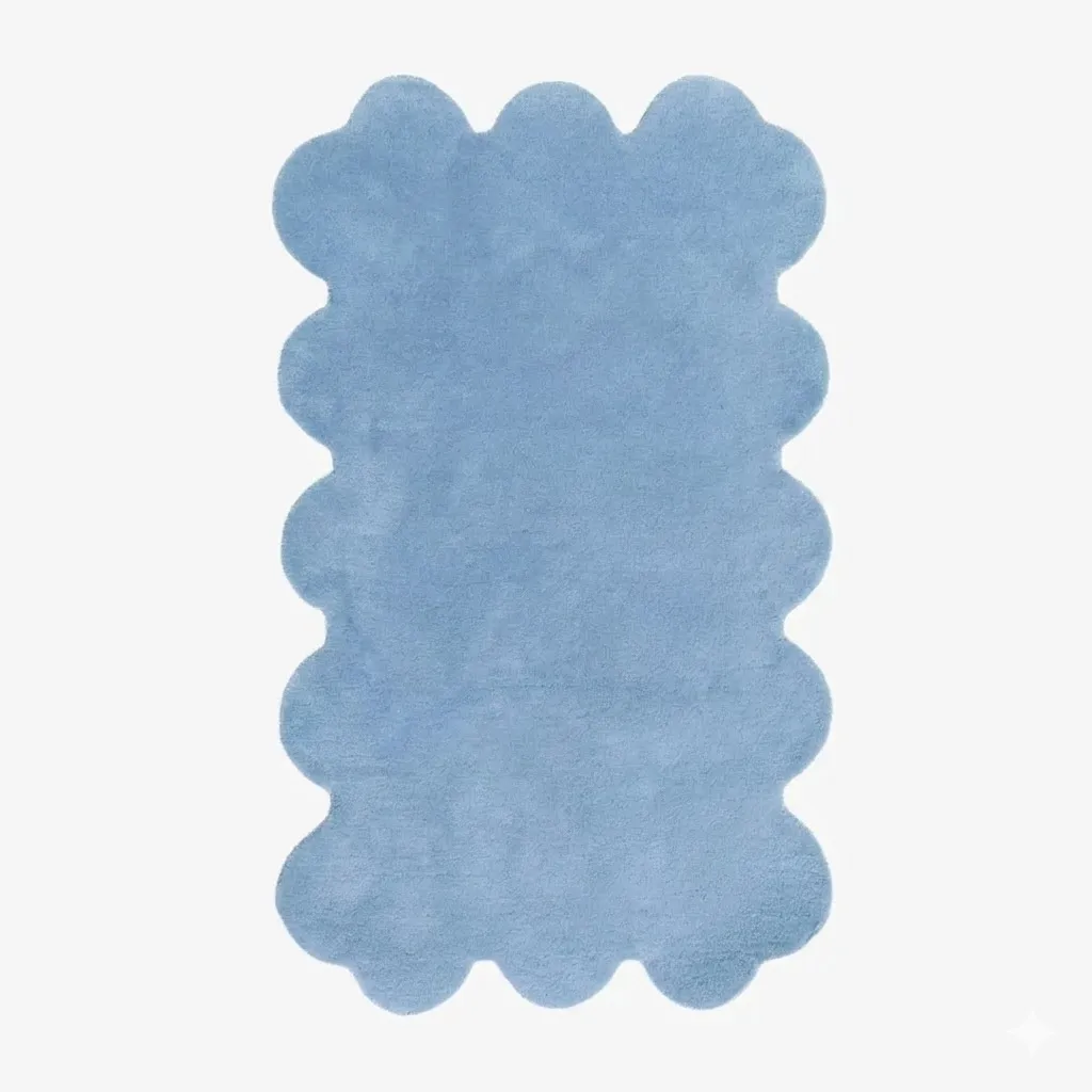 Top down view of the Scallop Solid Blue rug, featuring a calming monochrome light blue design with a soft hand-tufted wool texture and elegant custom shaped scalloped edges.