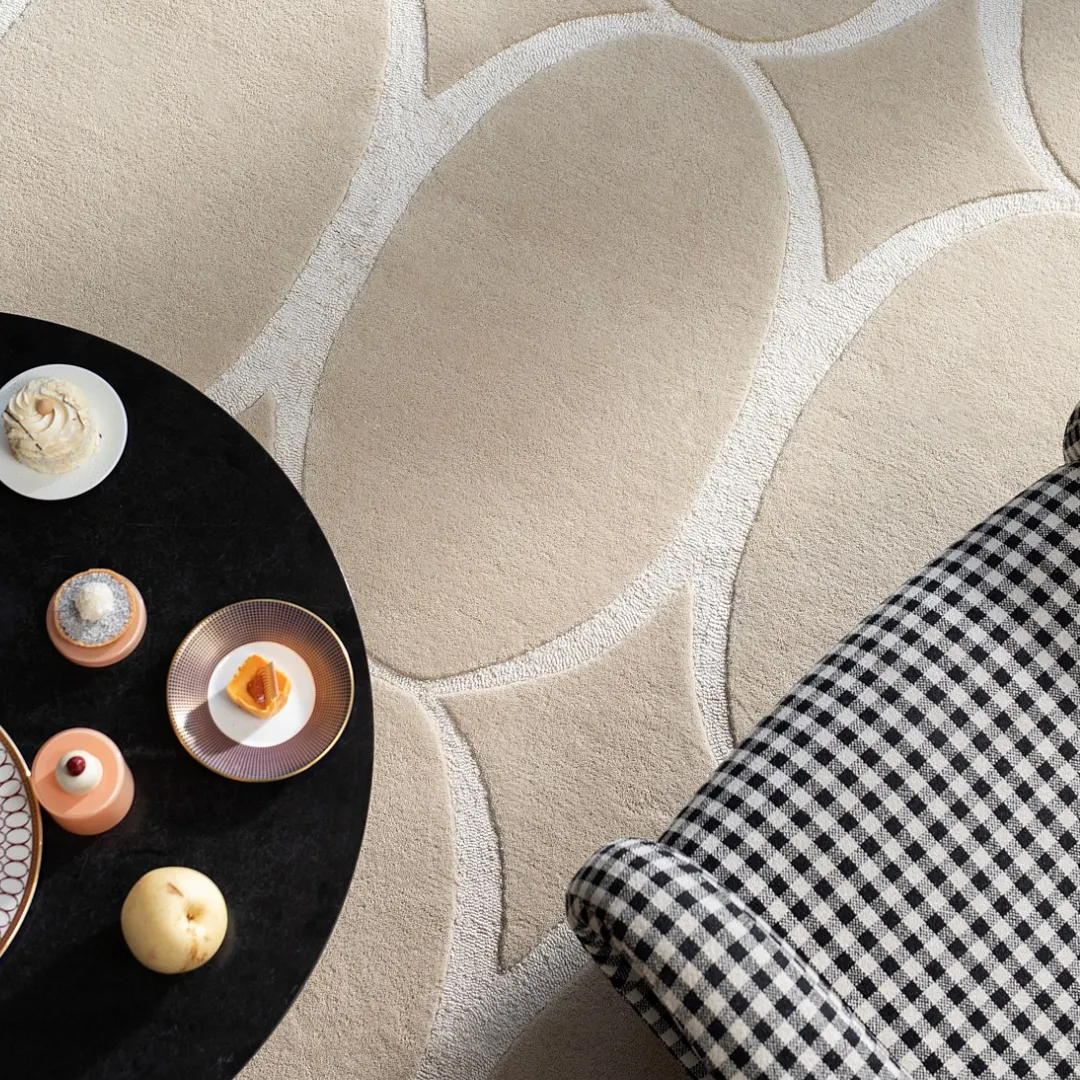 Hand-tufted beige rug in neutral space