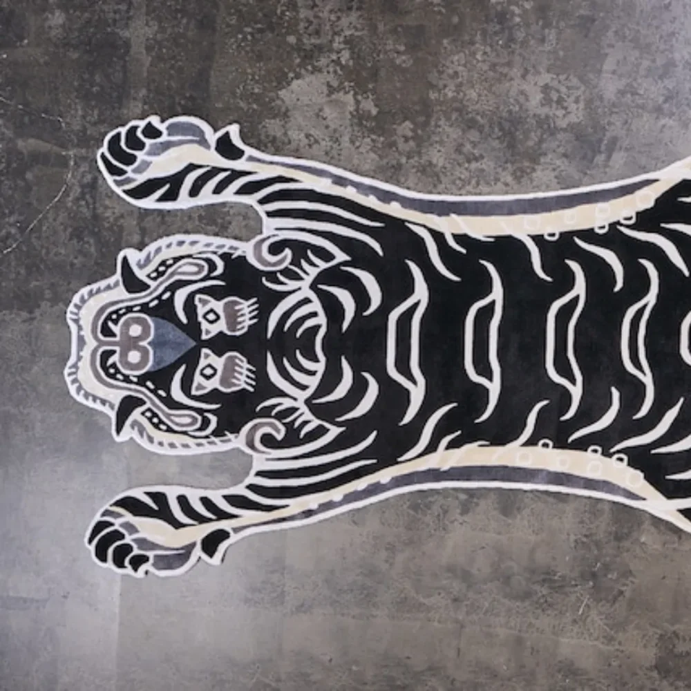Traditional Tibetan tiger carpet in high-contrast black and ivory