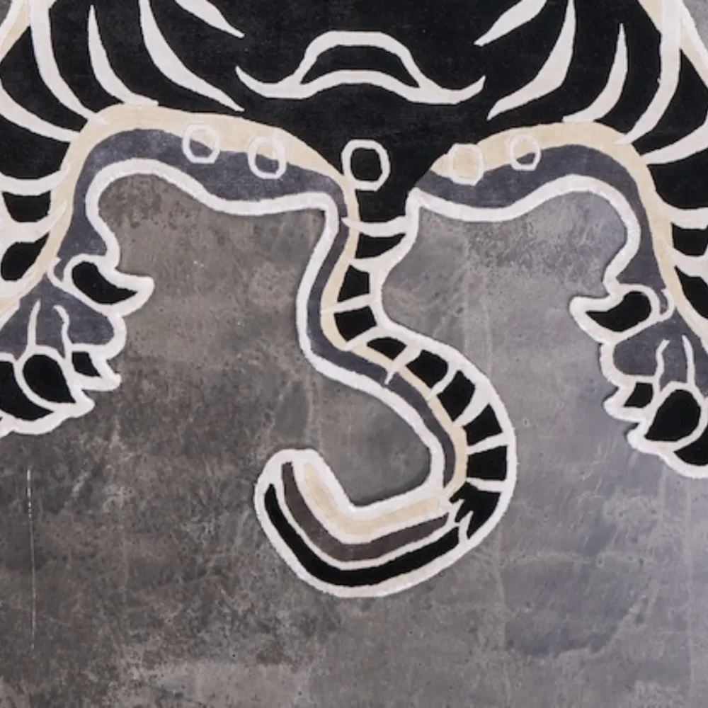 Animal print area rug with Tibetan tiger design in black and white
