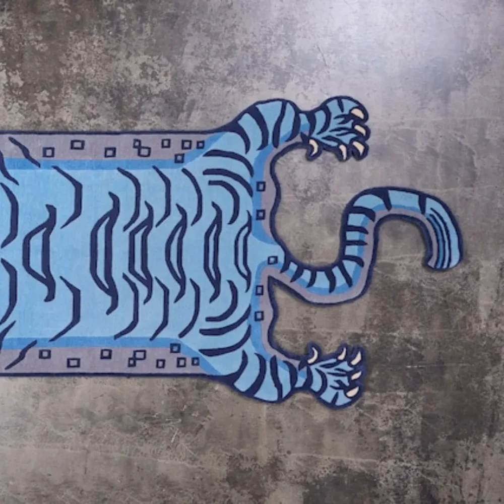 Animal print area rug featuring a Tibetan tiger motif