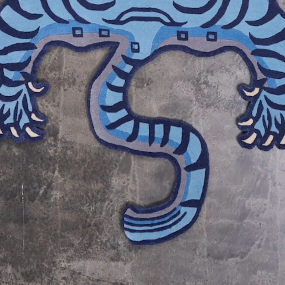Animal print area rug featuring a Tibetan tiger motif