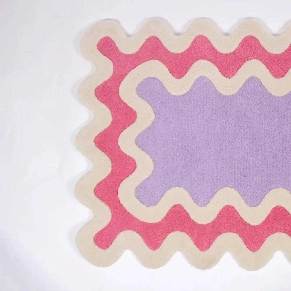 Wavy-edge pastel runner rug in narrow hallway