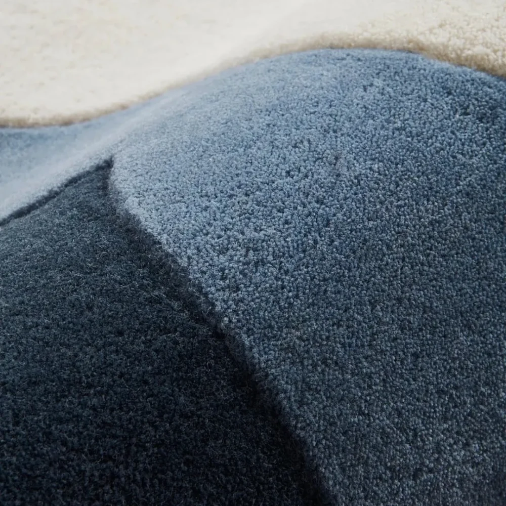 Close-up of hand-tufted texture and blue gradient