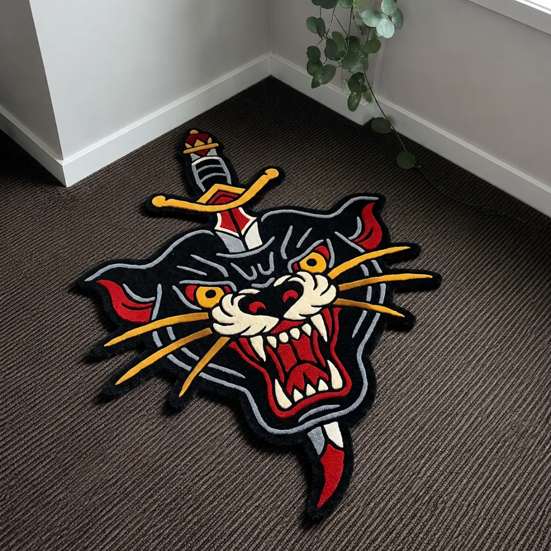 Angle view of the handmade Panther Dagger tufted rug showcasing its unique contours and traditional tattoo design.
