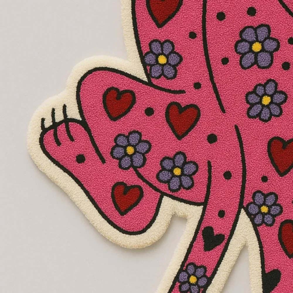 Custom-shaped pink love panther rug with floral and heart details