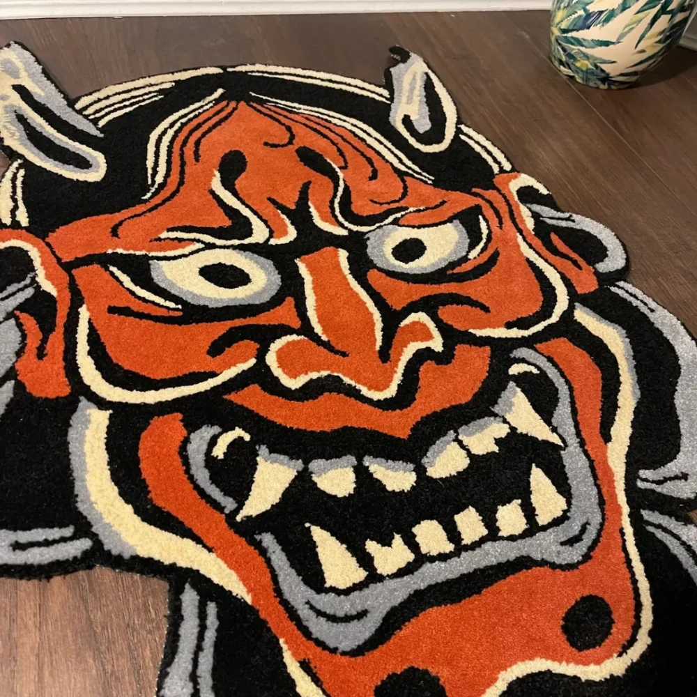 Close-up of hand-tufted wool texture on red Hannya rug