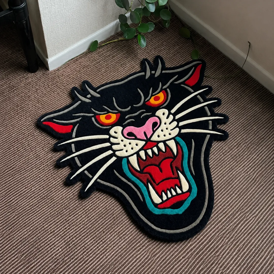 Angle view of the handmade Roar Panther Head tufted rug showcasing its unique contours and fierce design.