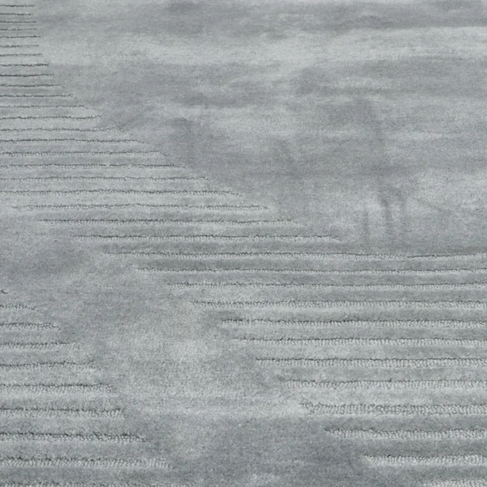 Minimalist gray rug with raised organic pattern