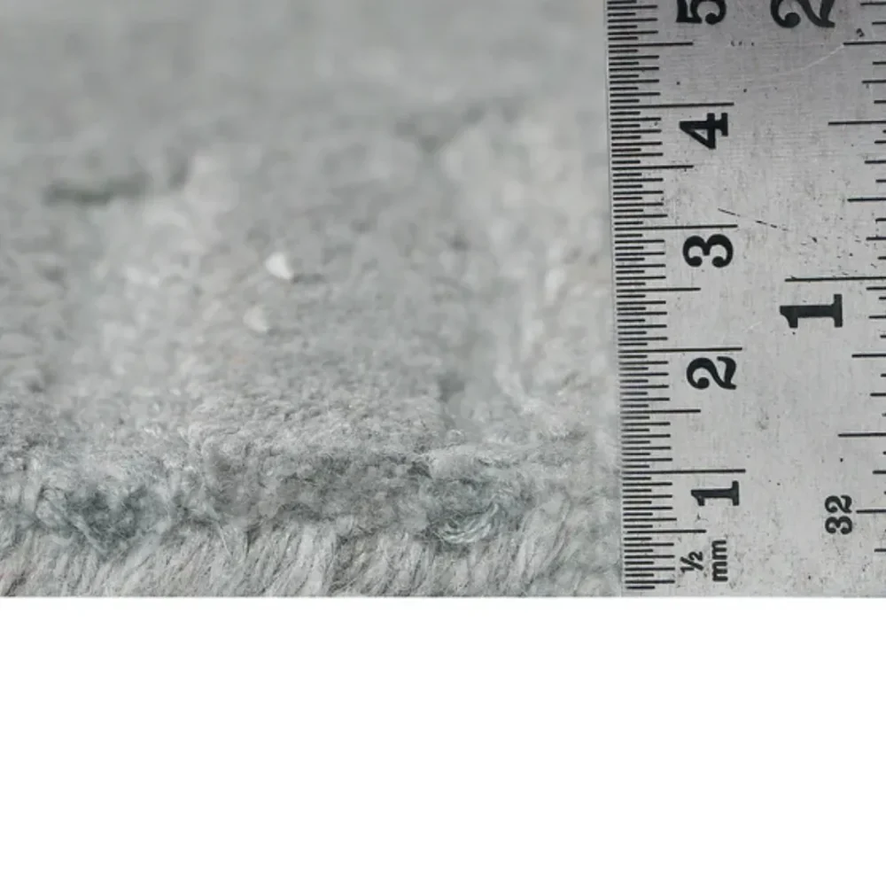 Modern monochrome rug with carved ripple texture