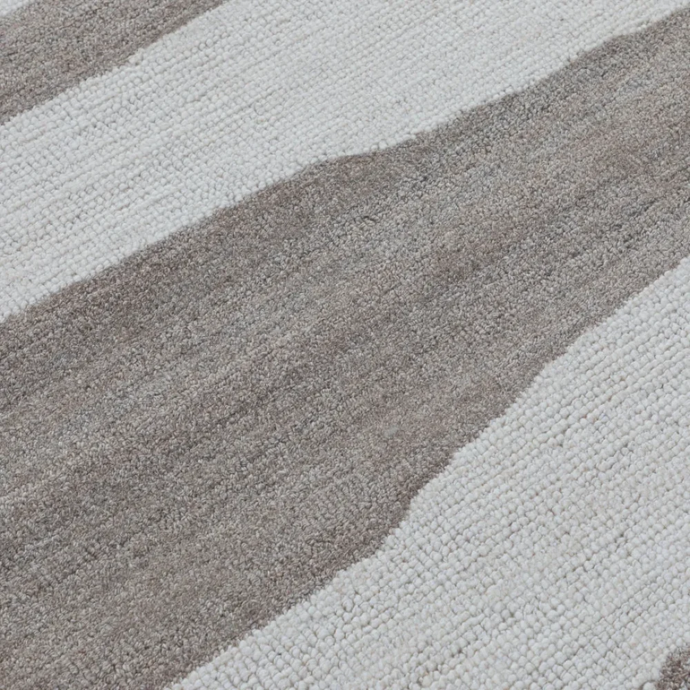 Wavy brown stripes rug in a modern bedroom or living space