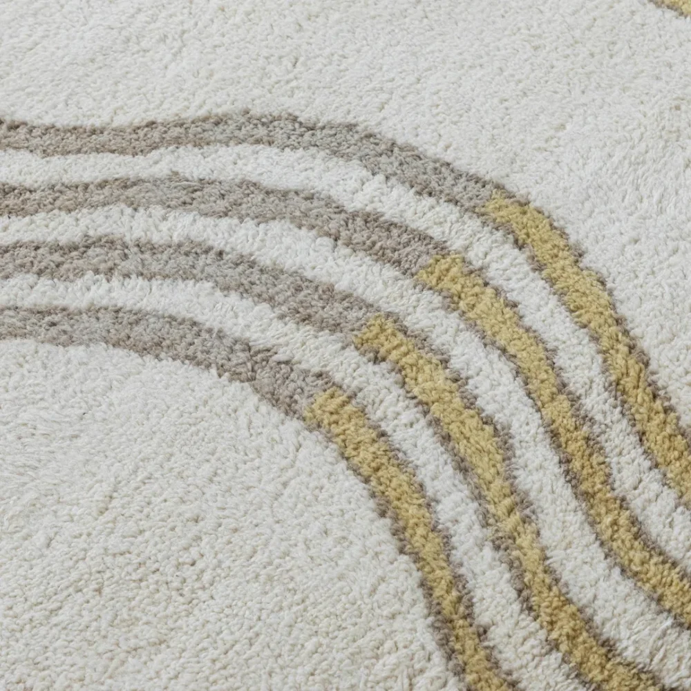 Detail of hand-tufted mustard and taupe stripes