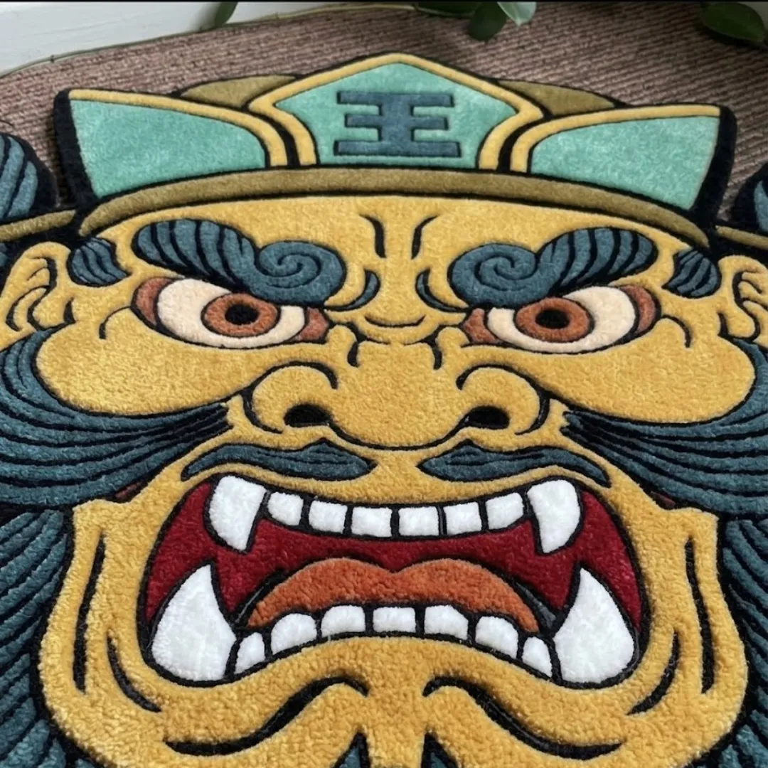 Close-up of the detailed tufted pile texture, fierce facial expression, and sharp teeth design on the Wrath Samurai Mask rug.