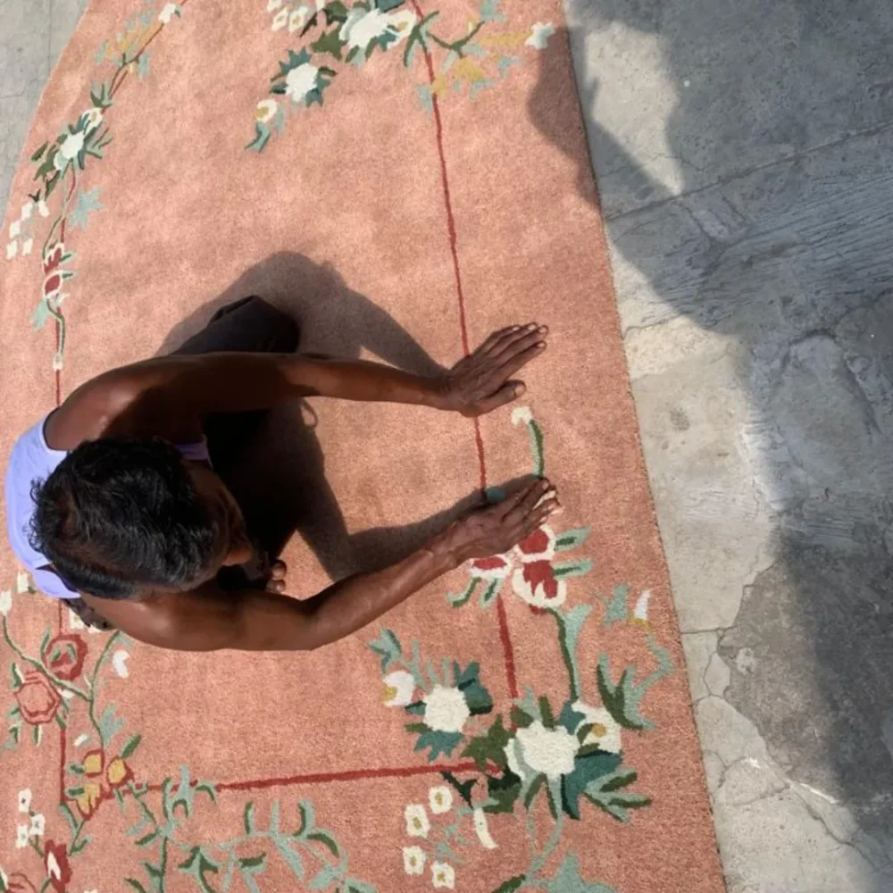 Stylish wool rug with pink, red, and green flowers