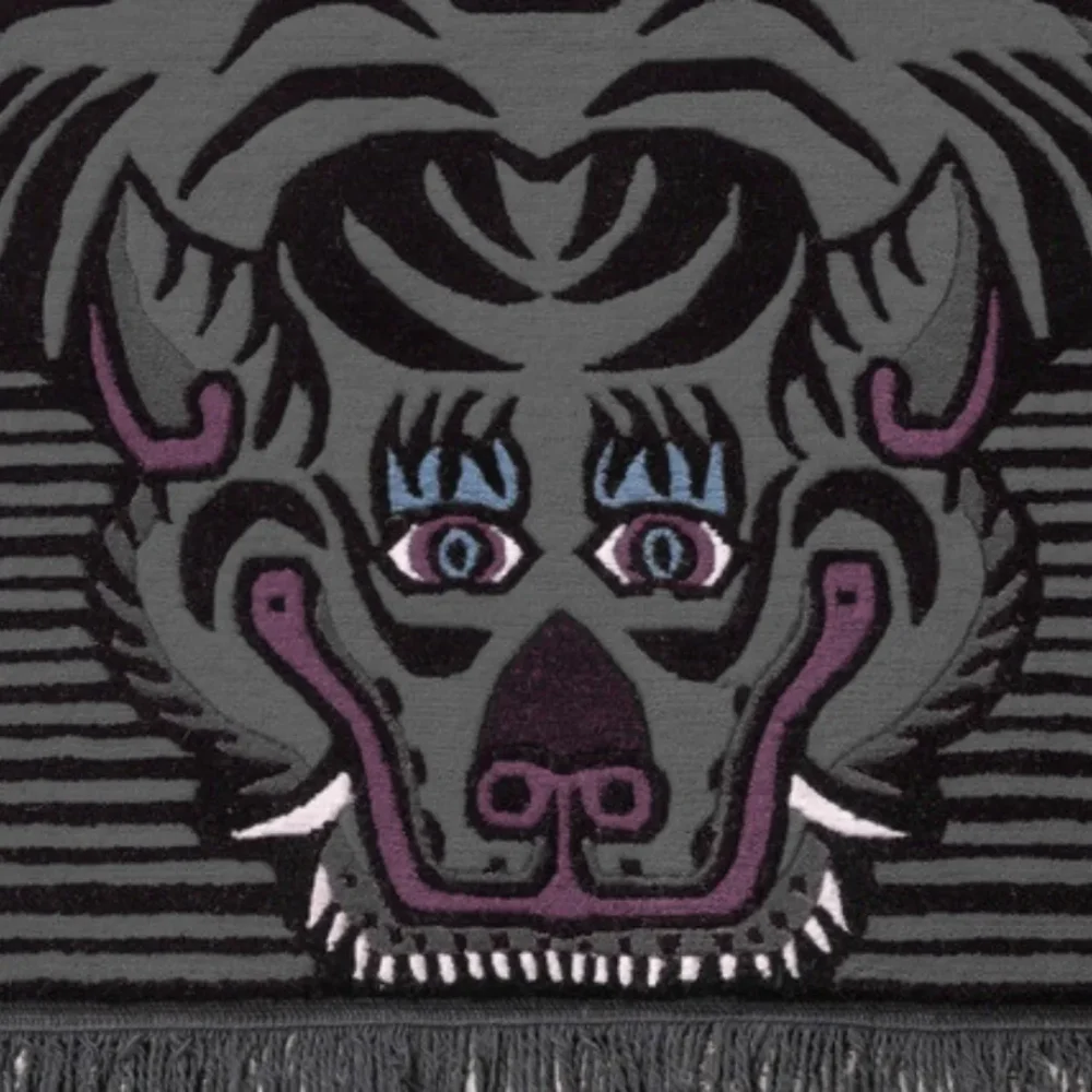 Black and grey tiger rug with striped pattern.
