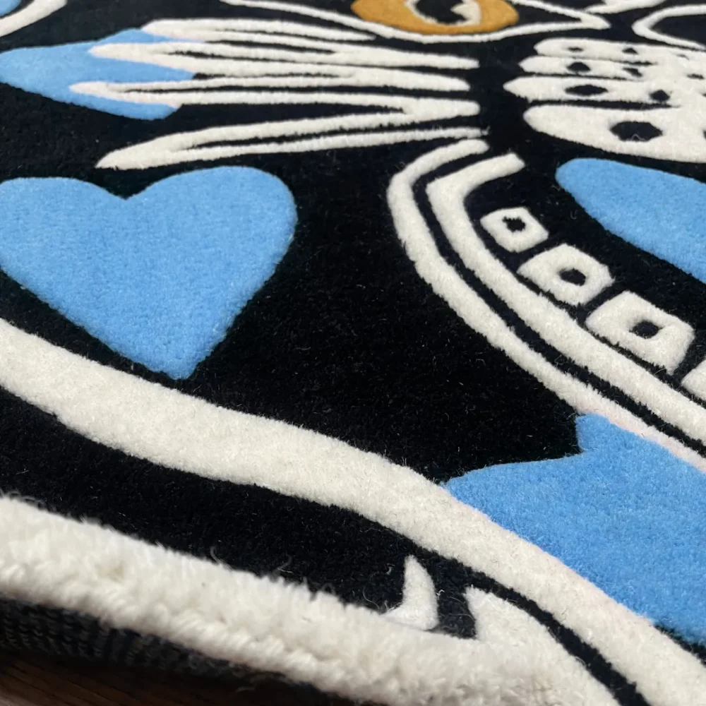 Custom-shaped panther head rug with black background and blue heart patterns, featuring fierce teeth and golden eyes