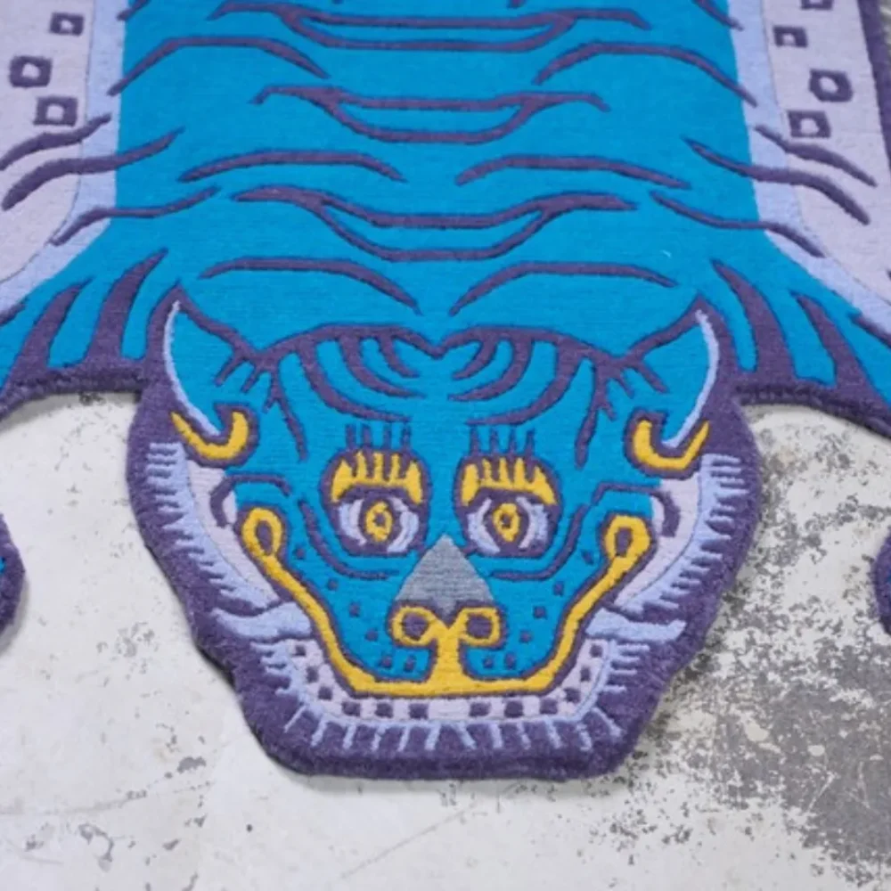 Blue Tibetan tiger rug on stone floor