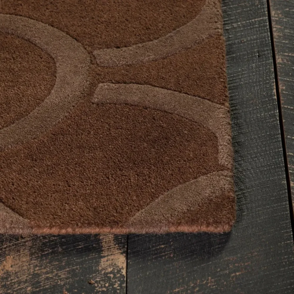 Modern wool rug with brown circle rings design