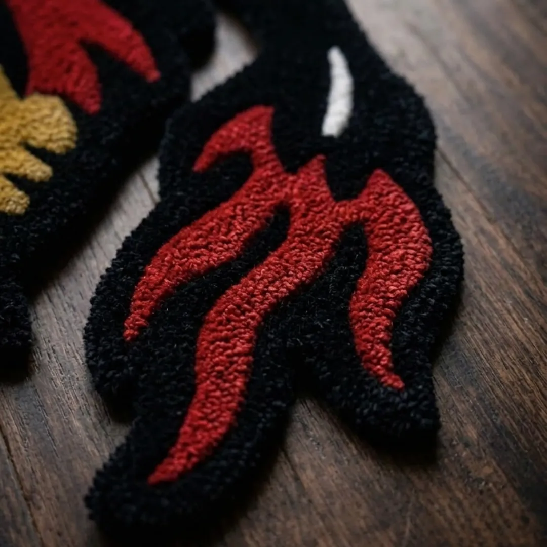 A macro close-up of the crawling eagle rug, focusing on the dense, tufted wool pile and the intricate graphic linework of the eagle design.