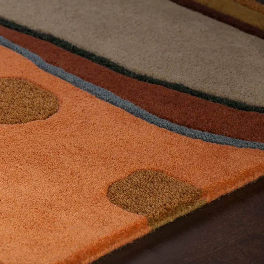Modern wool rug with playful abstract shapes and dots