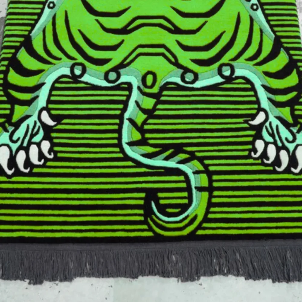 Green tibetan tiger-shaped rug with black stripes and striped background – bold floor décor with Tibetan-inspired design