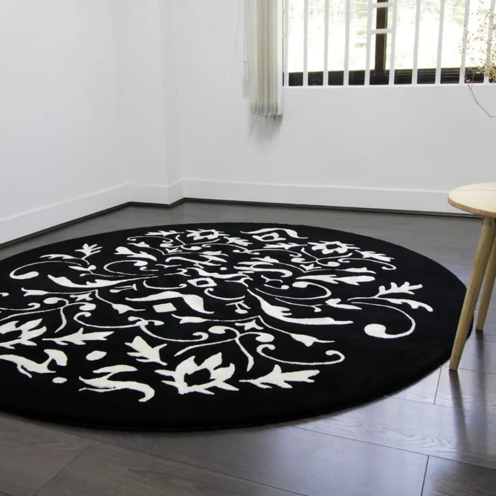 Stylish black round rug featuring white flower details