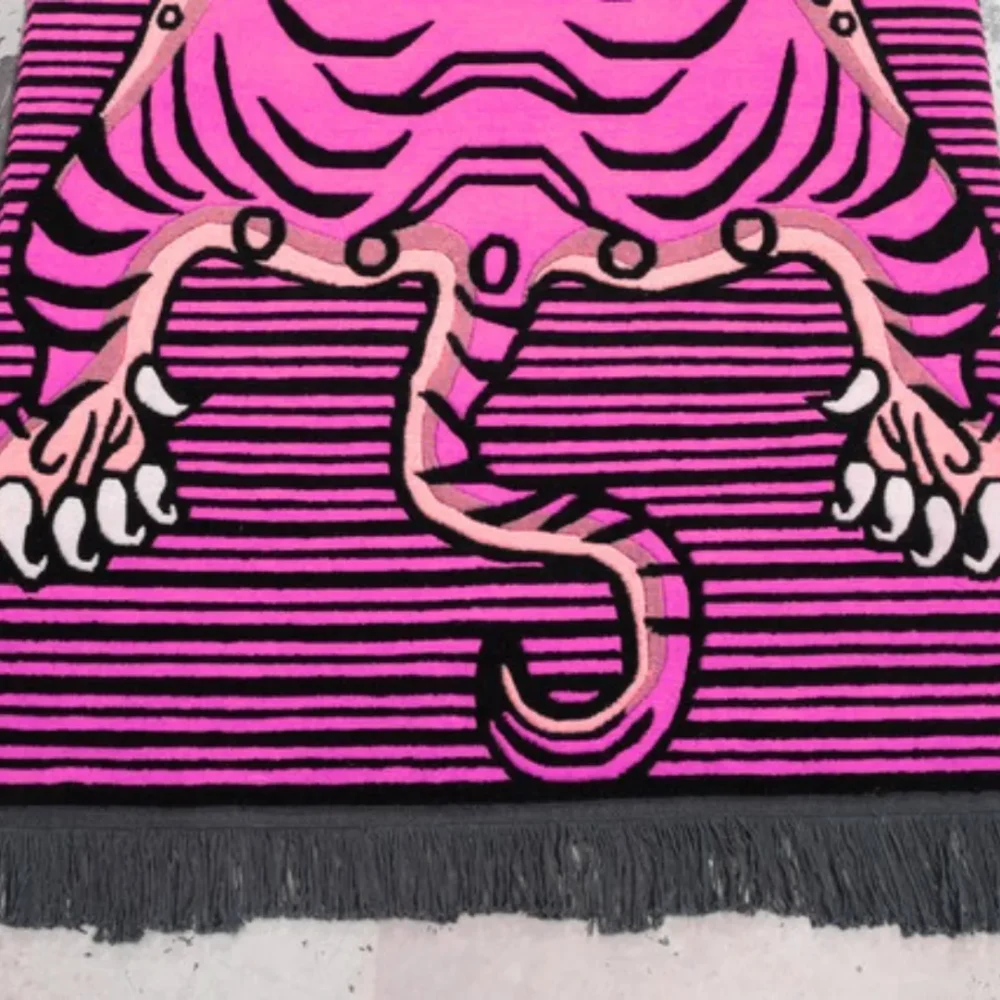 Featuring a vivid tiger motif with black stripes and a funky striped background. A fierce décor upgrade.