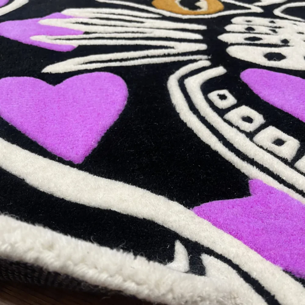 Custom-shaped panther head rug with black background and purple heart patterns, featuring fierce teeth and golden eyes in a tattoo-inspired design zoom in.