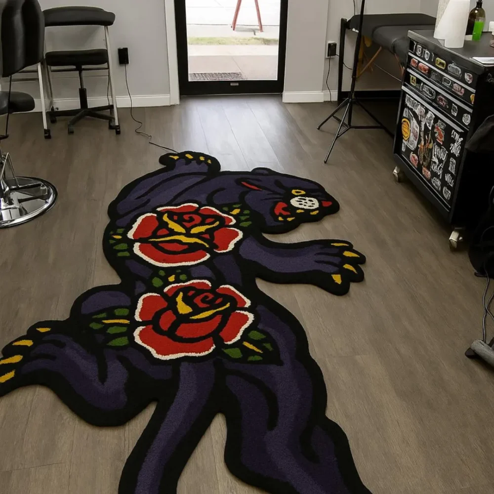 Hand-tufted panther rug with bold red and yellow rose flowers