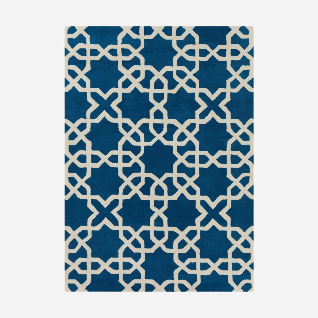 Blue and white wool rug with geometric star pattern