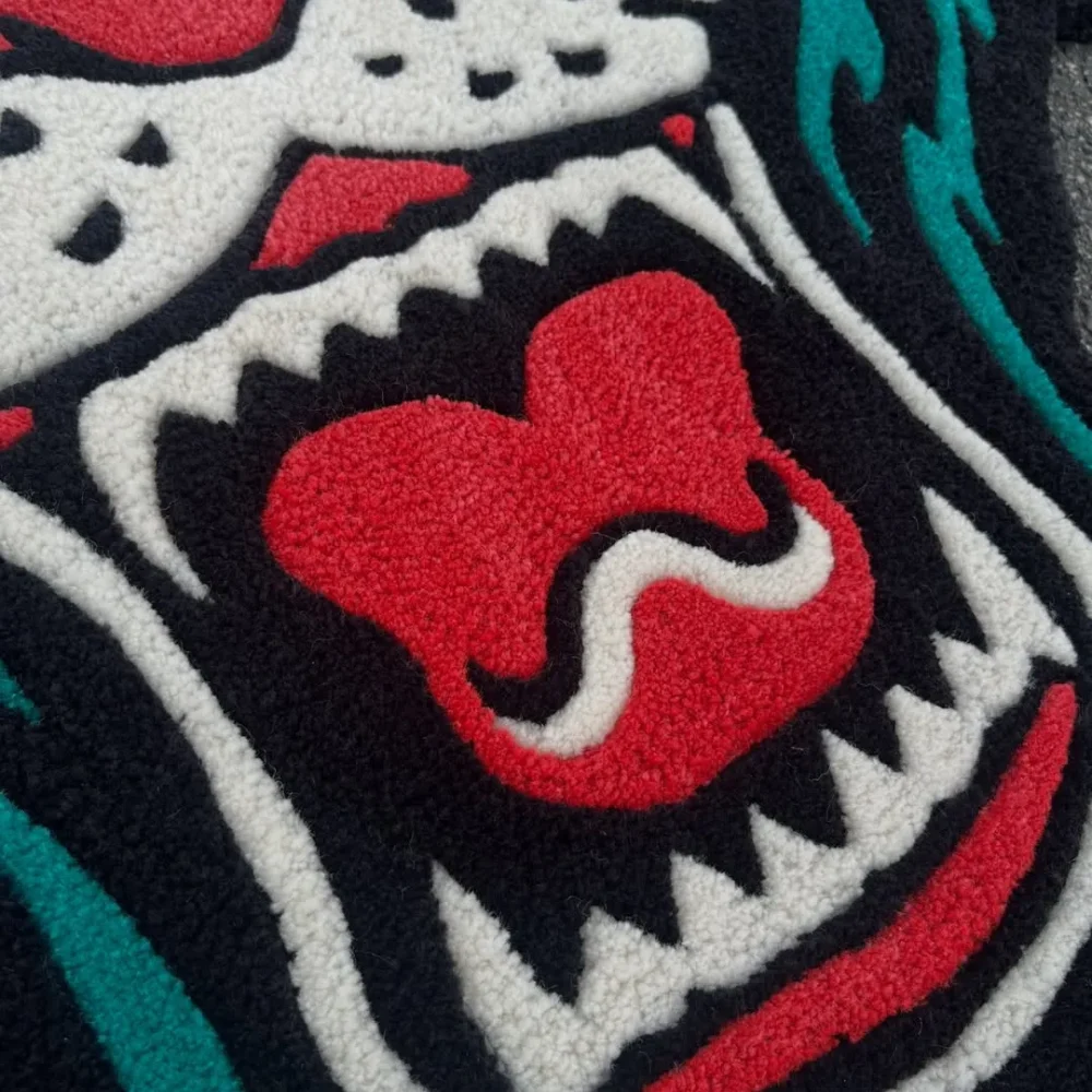 Fierce black and red tattoo-style panther wool rug