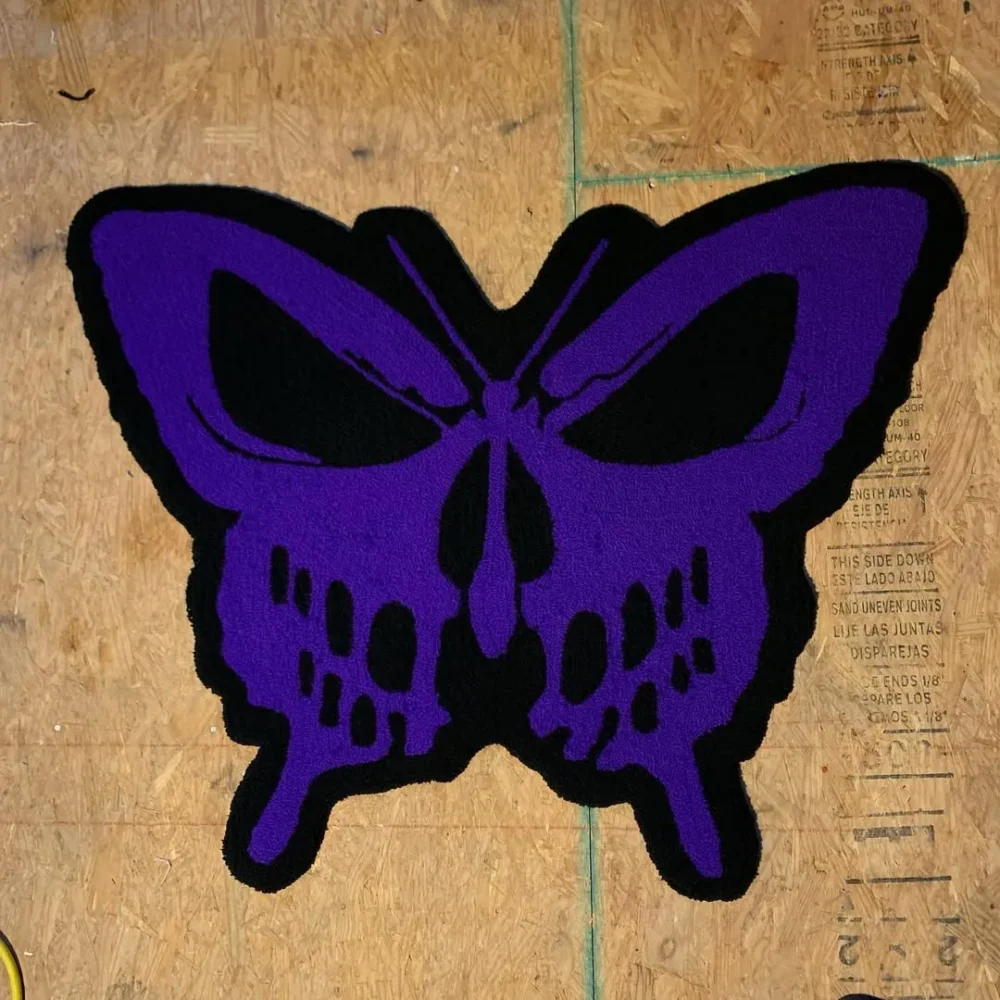 Unique wool rug with purple butterfly and skull pattern