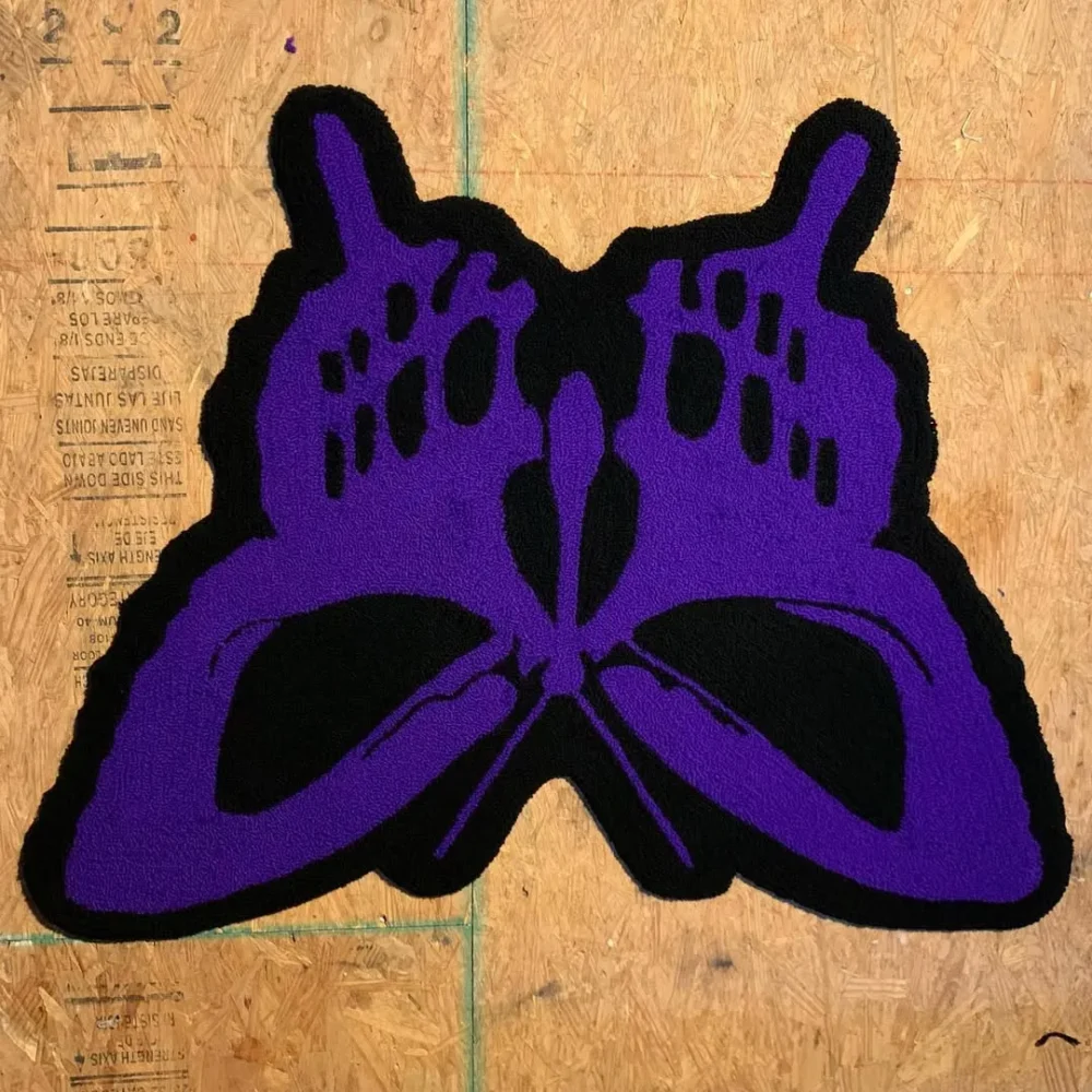 Bold and edgy purple and black skull butterfly rug