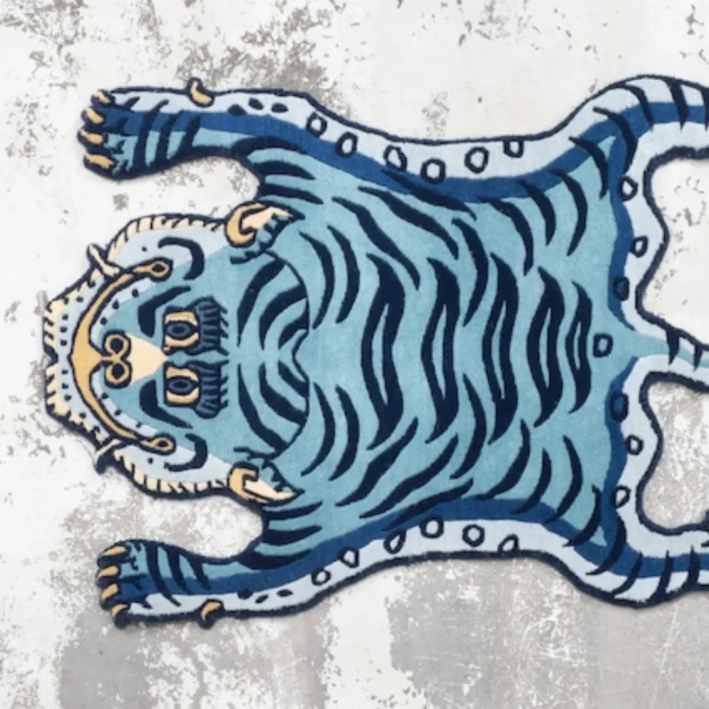 Blue tiger-shaped rug with hand-tufted details