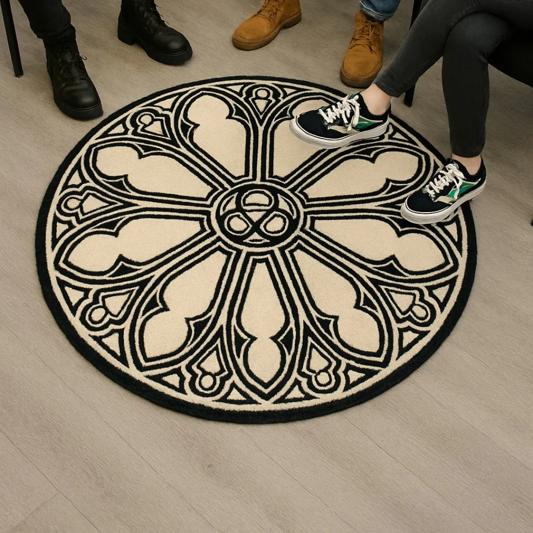 Black and cream tattoo rug featuring intricate architectural patterns.