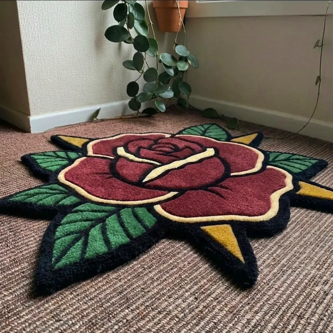 A detailed close-up perspective of the classic rose rug, highlighting the dense, high-quality tufted wool texture and the bold, graphic lines of the rose design.