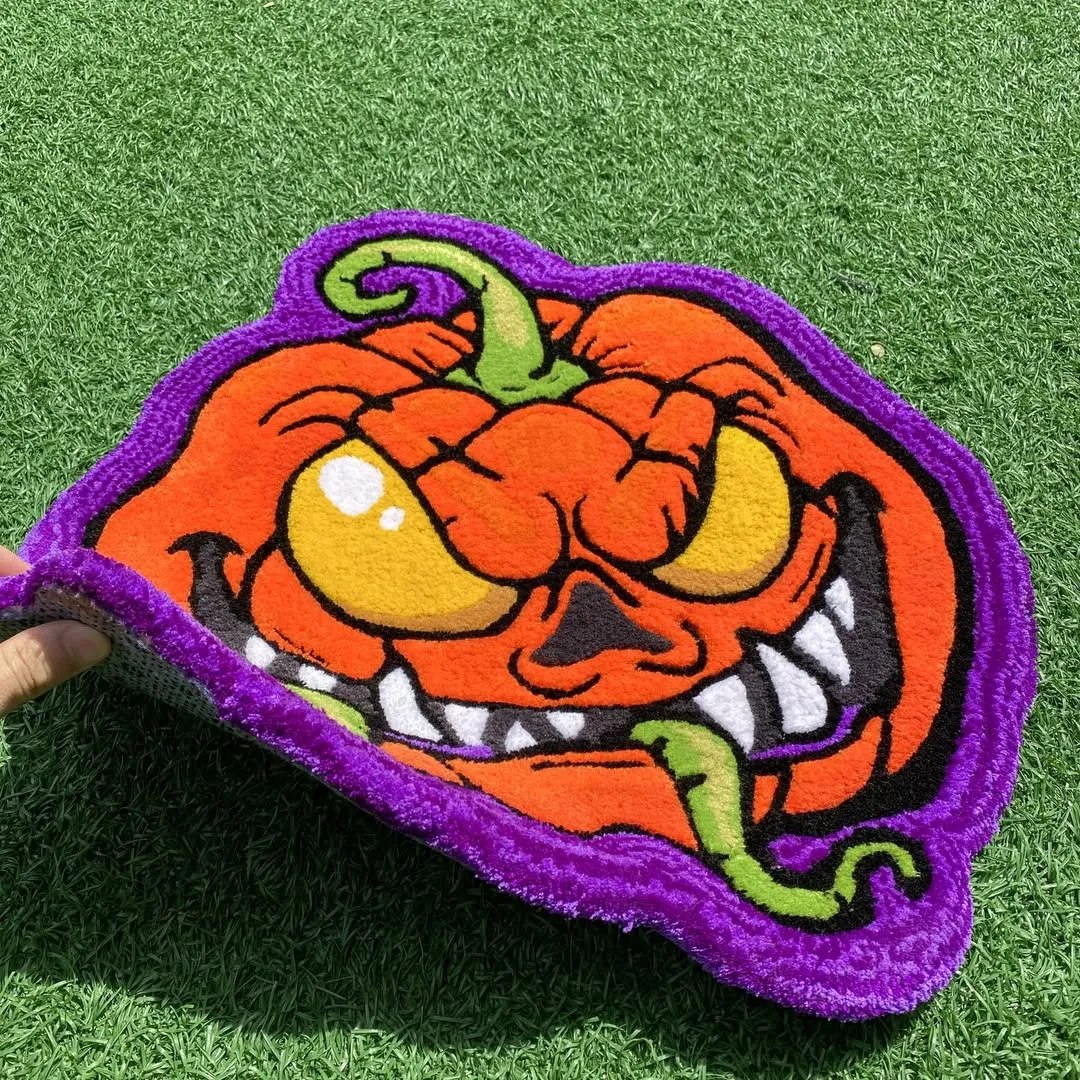 Handcrafted Halloween pumpkin wool rug with a sinister grin