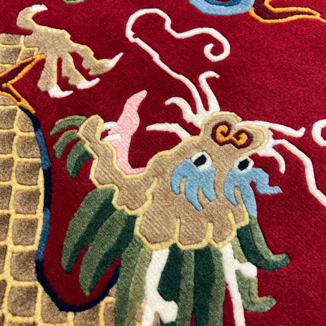 Bold red area rug with two golden dragons and colorful geometric details.