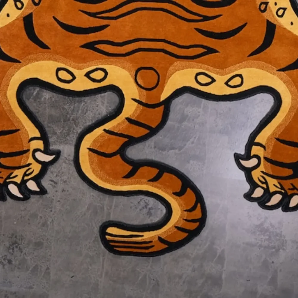 Hand-tufted rug showcasing the fierce features of a Tibetan Tiger