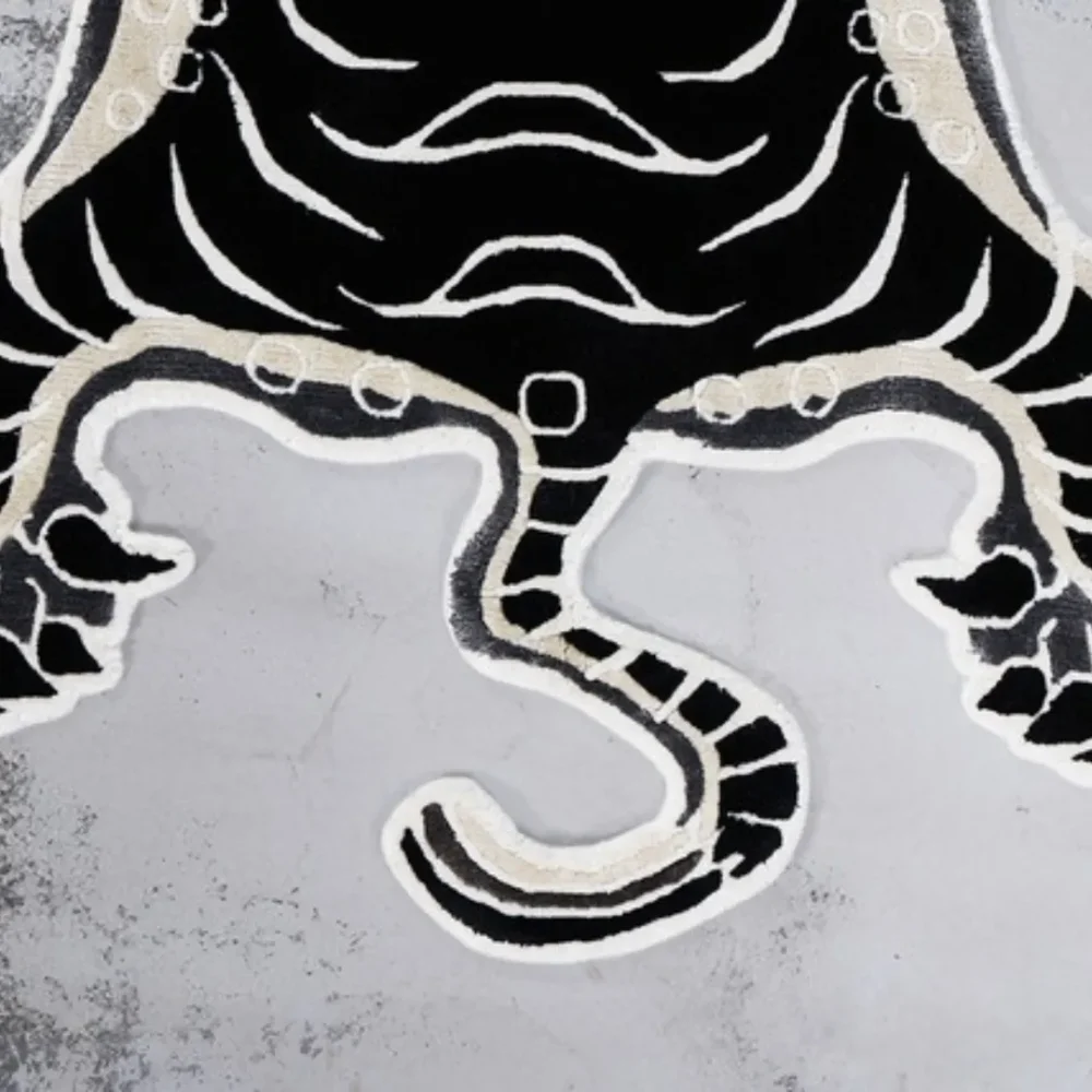 Detailed tiger features in bold black-and-white tones on the Shadow Stripes Wool Rug