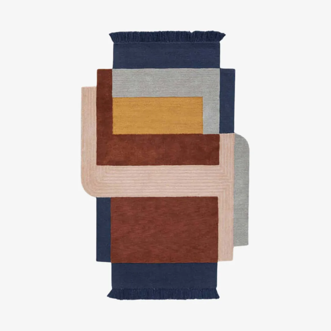 Solana Rug featuring geometric blocks in navy blue, mustard yellow, and terracotta.
