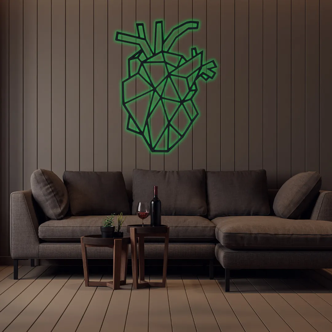 Green Geometric Heart Silhouette Black geometric heart wall hanging above sofa.