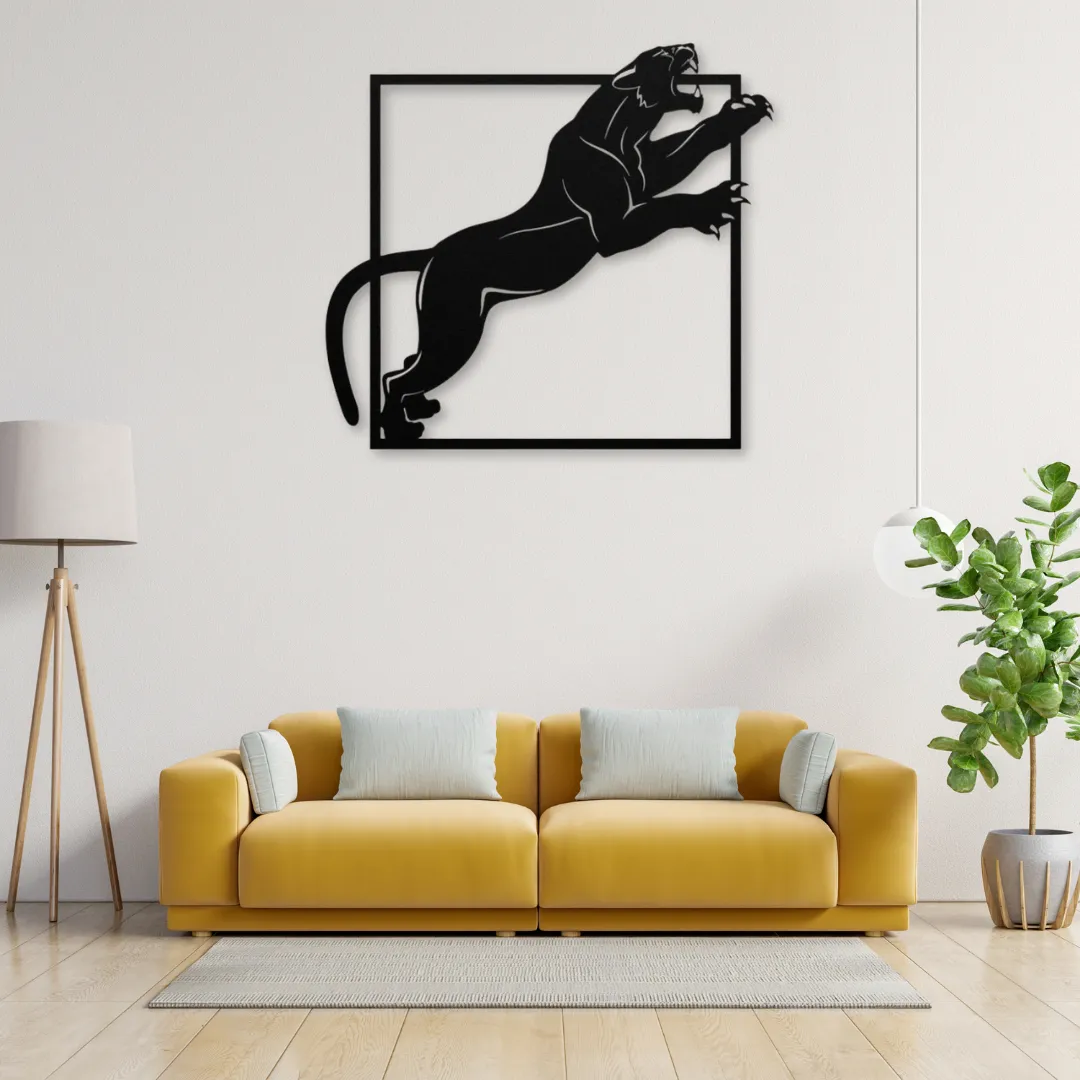 Midnight Panther Silhouette Fierce black panther metal wall art above modern yellow sofa.