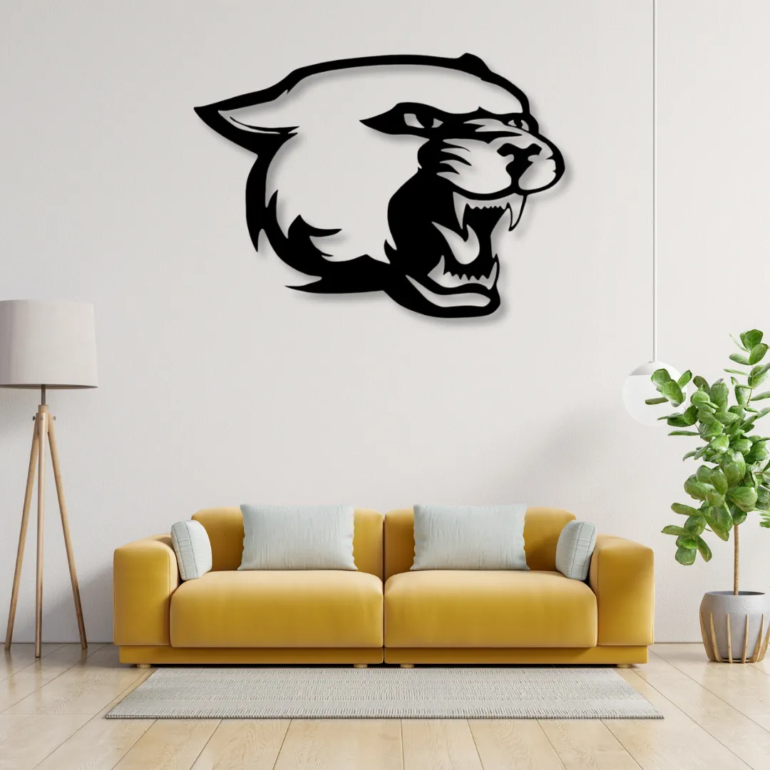 Panther head metal wall art above yellow sofa in living room.