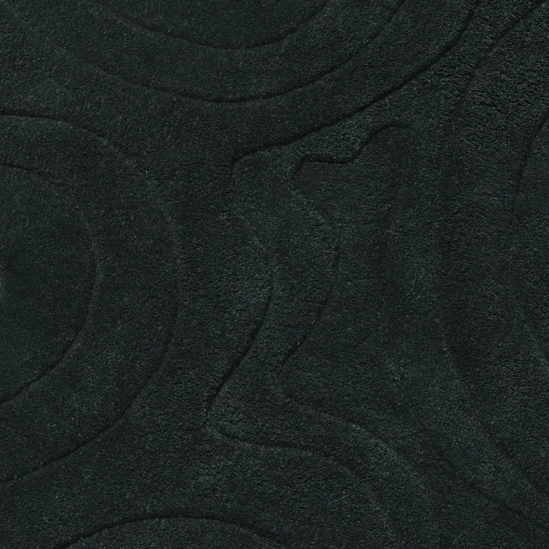 Contemporary black rug inspired by natural wave forms – Charcoal Drift handmade area rug