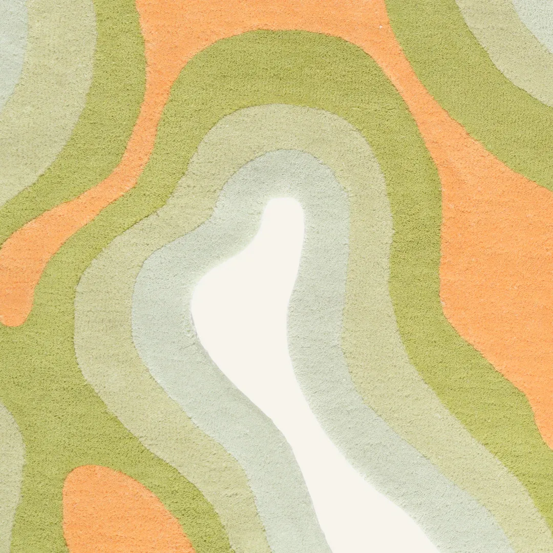 Playful area rug with citrus-inspired color palette and wavy pattern – Citrus Glow handmade designer rug