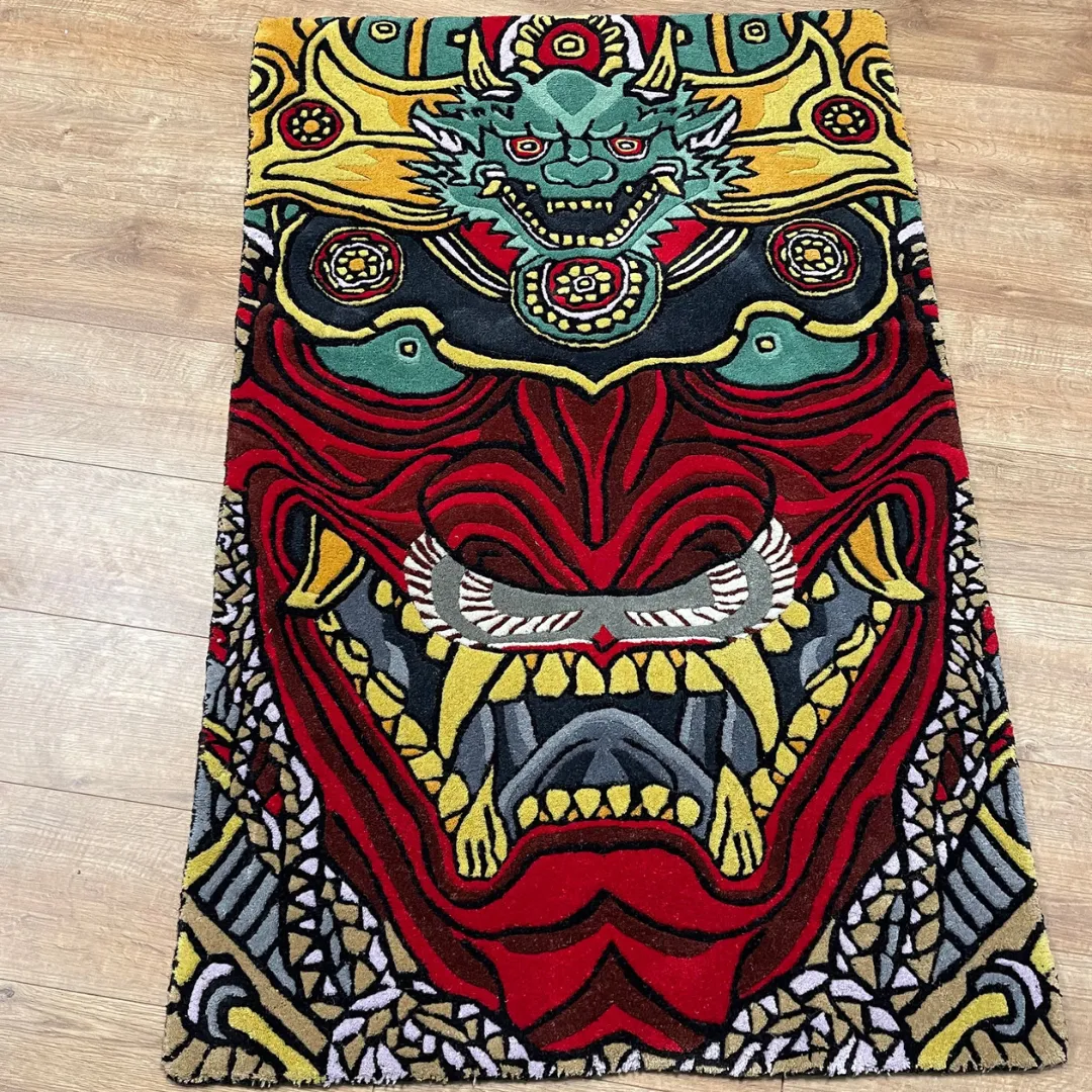 Drakona Inferno Rug featuring fierce red and gold dragon mask design with intricate detailing – handmade tufted rug by Sneagear