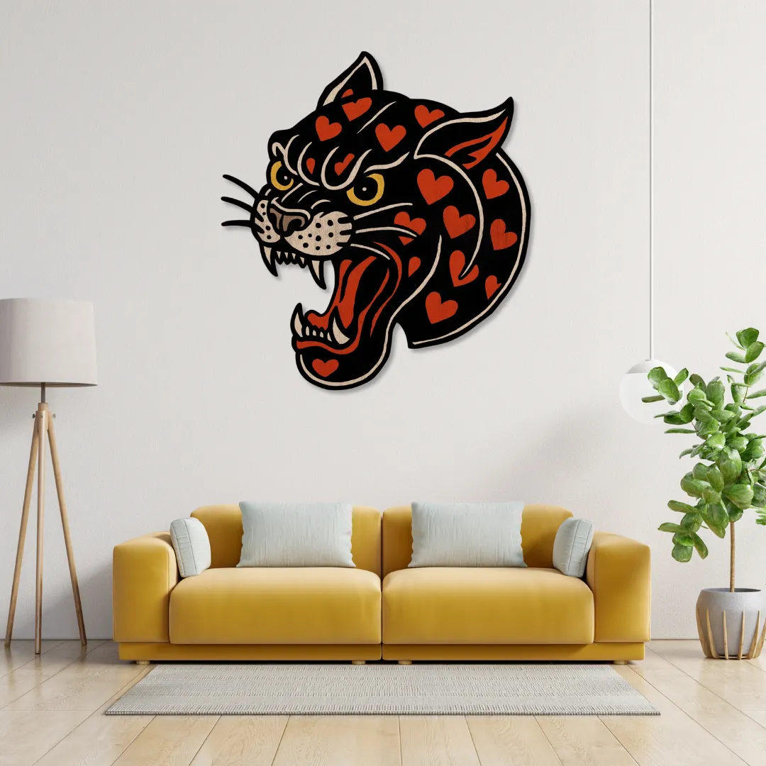 Heart Panther Wall Art above mustard sofa – fierce handcrafted metal wall decor with red heart details by Sneagear.